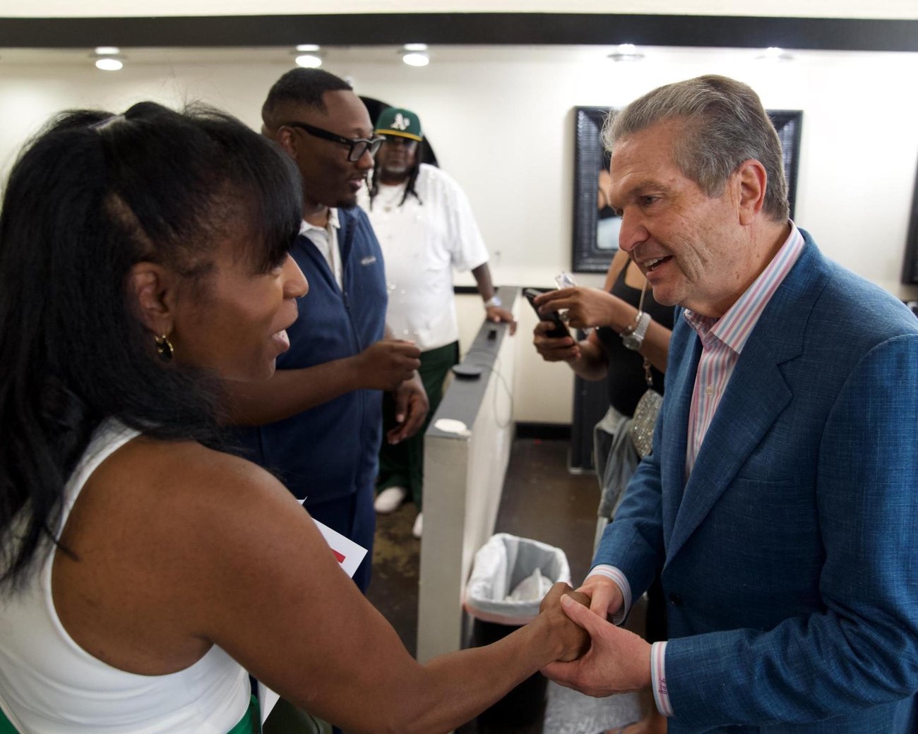 Republican gubernatorial nominee Rick Jackson speaks with local residents at Salon Dollhouse/Barbers Inc. in College Park on June 29. (Jackson For Governor Inc.)