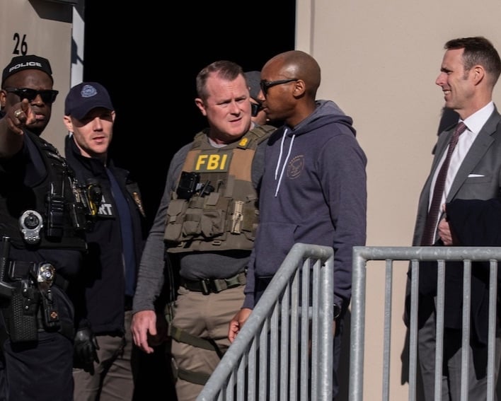 FBI agents gather at the Fulton County Election Hub and Operation Center in Union City on Jan. 28. (Mike Stewart/Associated Press)