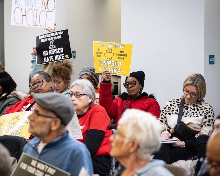 Residents gather at the Gary Public Library’s Carter G. Woodson Branch in December 2024 to urge state regulators to reject a proposed NIPSCO rate hike. (Javonte Anderson/Capital B)